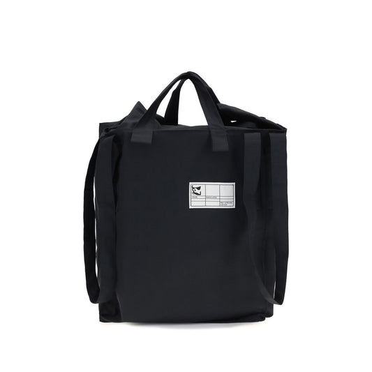 Small Shoulder Tote Bag by GR10K for men in polyester black features a distinguished silhouette, showcasing a secure and distinguished with versatile shoulder-strap & handle for a distinguished finish.