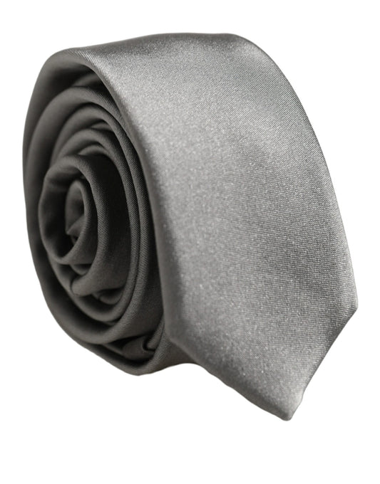Necktie by Dolce & Gabbana for men in silk satin gray features a sun-drenched silhouette, showcasing the sun-drenched design of this Silk Satin Necktie with a sun-drenched finish.
