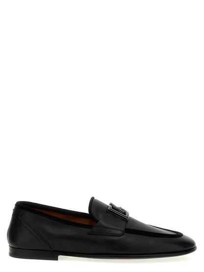 Loafer Slip-On Shoes by Dolce & Gabbana for men in suede calfskin leather black showcases a resplendent Men's Suede Calfskin Leather Loafer Slip-On Shoes aesthetic, defined by its resplendent and elegant .