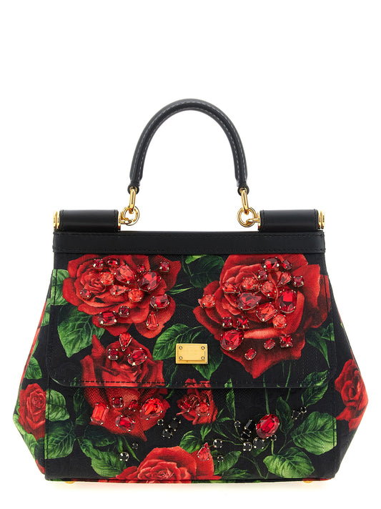 This Small Flap Handbag by Dolce & Gabbana for women in silk cotton leather & canvas and black, red & signature presents a sculptural silhouette featuring a secure flap, ample , and versatile shoulder-strap & handle for a sculptural finish.