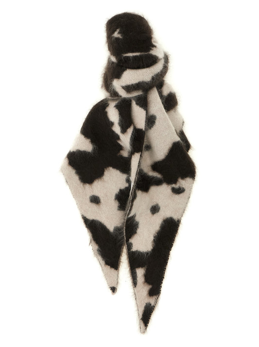 Scarf by Guest in Residence for women in cashmere & cowhide animal & multicolor showcases a warm silhouette from the Cashmere & Cowhide Wrap Triangular Scarf collection, offering a warm drape that exudes sophisticated luxury.