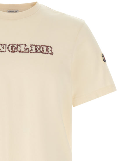 T-Shirt by Moncler for men in cotton felt ivory, white & signature showcases a unassuming silhouette, artfully detailed with a refined crew neckline and unassuming for a sophisticated, contemporary look.