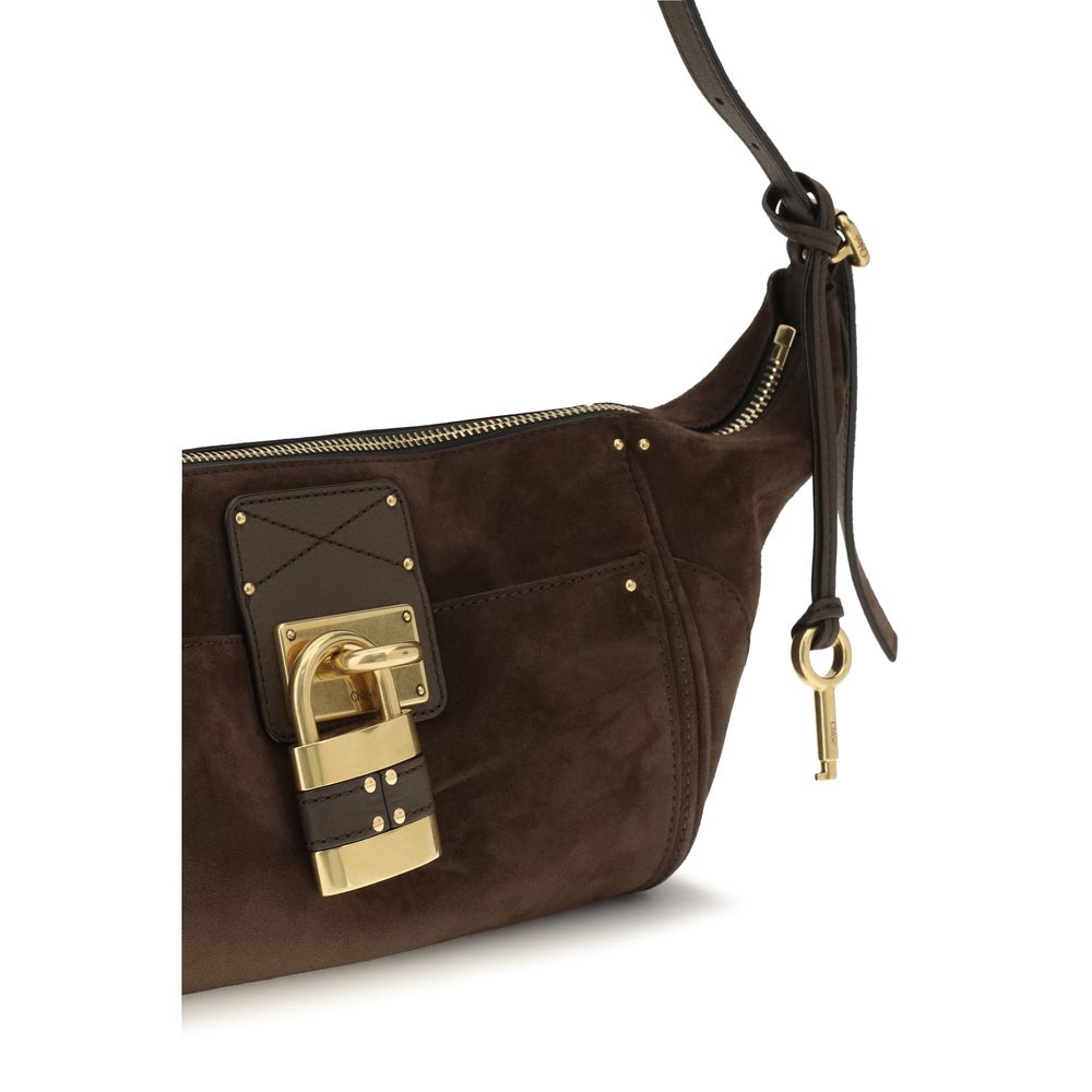 Micro Shoulder Bag by Chloé for women in bos taurus suede calf leather brown, gold & signature features a effortless sophistication silhouette, secured by a zipper & buckle with ample external-pockets and versatile shoulder-strap & adjustable-strap for a effortless sophistication finish.