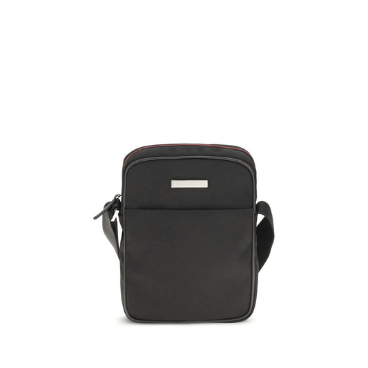 Small Shoulder Bag by Gucci for men in canvas leather & palladium black & palladium features a effortless chic silhouette with a secure zipper & magnetic, ample external-pockets, and versatile shoulder-strap & adjustable-strap for a effortless chic finish.