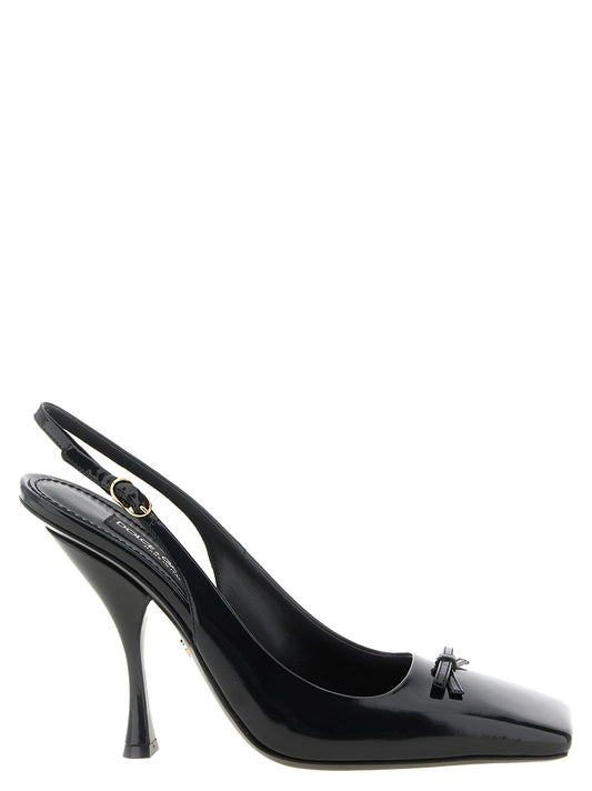 High-Heel Slingback Pumps Heels by Dolce & Gabbana for women in calfskin leather black & gold features an captivating silhouette, showcasing the elegant Women's Calfskin Leather High-Heel Slingback Pumps Heels design with a high-heel and a sophisticated square toe style.
