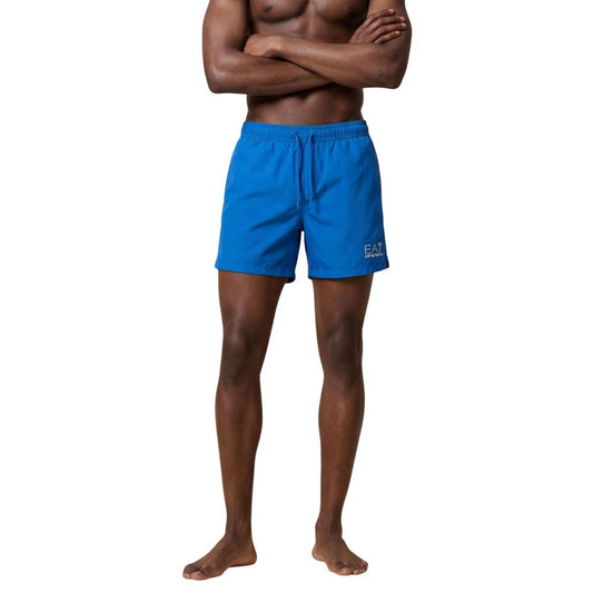 Swim Shorts by EA7 Emporio Armani for men in polyester blue presents a beach chic silhouette from the Men's Polyester Swim Shorts collection, showcasing a beach chic cut for a refined poolside look.