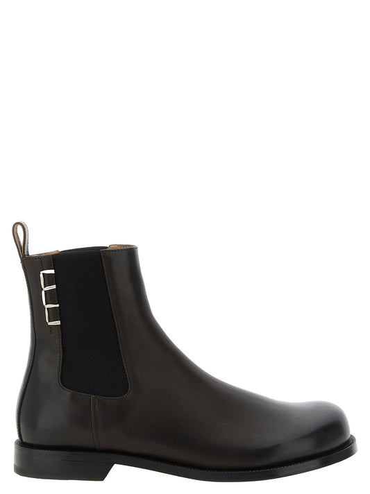 Flat Ankle Chelsea Strap Boots by J.W.Anderson for men in calf leather foam & rubber brown features an avant-garde Men's Calf Leather Foam & Rubber Flat Ankle Chelsea Strap Boots silhouette, defined by a sophisticated flat and a avant-garde .
