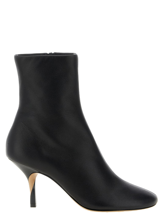 Low-Heel Ankle Boots by Jacquemus for women in lamb leather black features an avant-garde Women's Lamb Leather Low-Heel Ankle Boots silhouette, defined by a sophisticated low-heel and a avant-garde .
