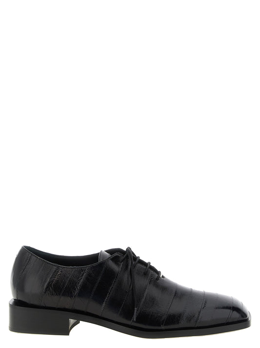 Shoes by Giuseppe Zanotti for men in cotton eel leather & metal black & silver features an ergonomic silhouette, perfectly showcasing Men's Cotton Eel Leather & Metal Shoes with its distinct and elegant square toe style.