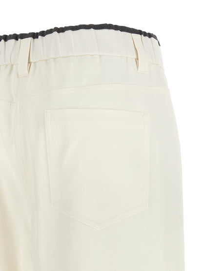 Trousers by Brunello Cucinelli for women in cotton white & signature presents a perennial silhouette, meticulously tailored with a straight-leg & relaxed-fit cut, long finish, and an elegant .