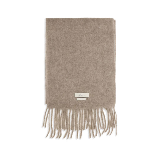 Scarf by Jacquemus for men in mohair polyamide & alpaca wool beige features a timeless silhouette, artfully capturing the essence of the timeless Mohair Polyamide & Alpaca Wool Fringes Scarf design for a sophisticated look.