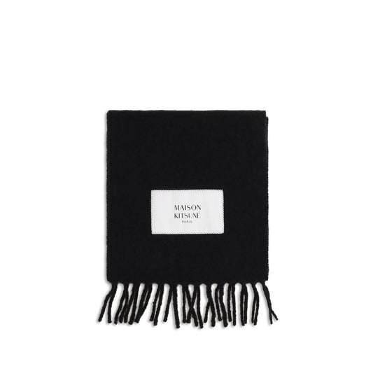 Scarf by Maison Kitsuné for men in alpaca wool & polyamide black & monogram presents a effortlessly chic silhouette, artfully capturing the essence of the effortlessly chic Alpaca Wool & Polyamide Fringes Scarf design for a sophisticated look.