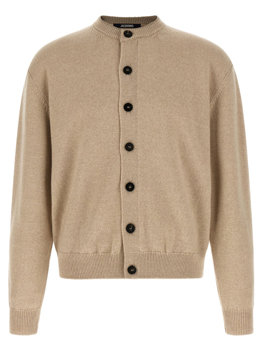 Cardigan by Jacquemus for men in merino wool beige showcases a captivating silhouette, artfully detailed with a captivating and round crew neckline for a truly sophisticated captivating look.