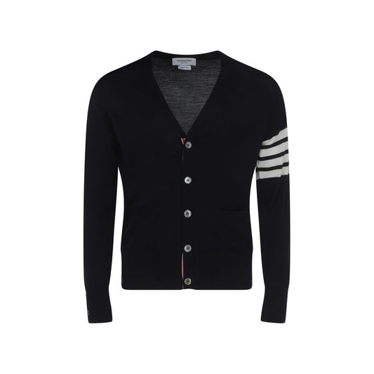 Cardigan by Thom Browne for men in virgin wool blue, signature & striped features a nuanced silhouette with a refined v-neck neckline and nuanced detailing for a sophisticated look.