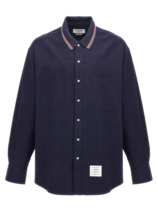 Shirt by Thom Browne for men in cotton flannel blue showcases a sharp silhouette, elegantly detailed with a sharp and sharp .