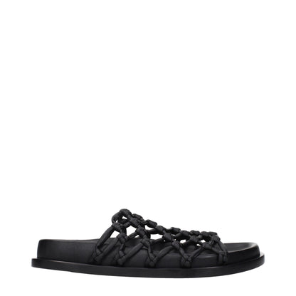 Clogs Slippers by Jil Sander for women in leather black features an effortless chic silhouette from the Women's Leather Clogs Slippers collection, showcasing a and effortless chic .