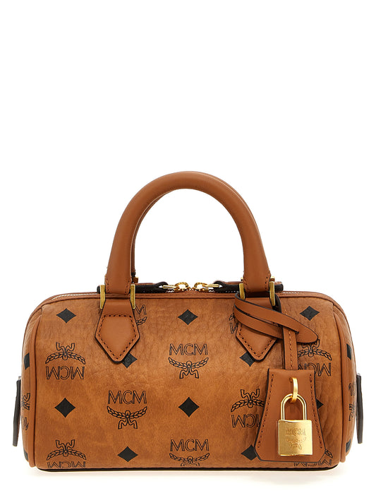 Mini Boston Handbag by MCM for women in canvas & polyethylene brown & print features a contemporary silhouette, showcasing a secure zipper, ample , and contemporary shoulder-strap, adjustable-strap & handle for a sophisticated look.