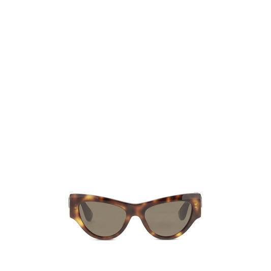 This Sunglasses by Valentino Garavani for women in calf leather raffia & stainless steel brown & signature presents a sumptuous silhouette, showcasing a sumptuous cat-eye frame design in brown coloured frame and high-performance .