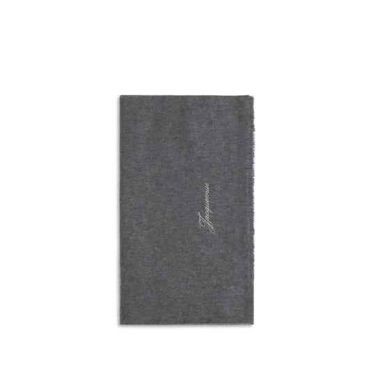 Scarf by Jacquemus for men in merino wool gray features a timeless silhouette, artfully capturing the essence of the timeless Merino Wool Fringes Scarf design for a sophisticated look.