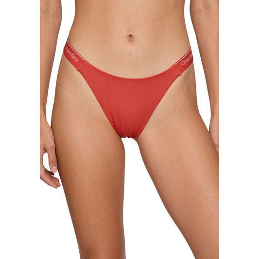 Bikini by Calvin Klein Jeans for women in stretch polyester orange presents a provocative silhouette, artfully capturing the essence of the provocative Women's Stretch Polyester Bikini design for a sophisticated look.