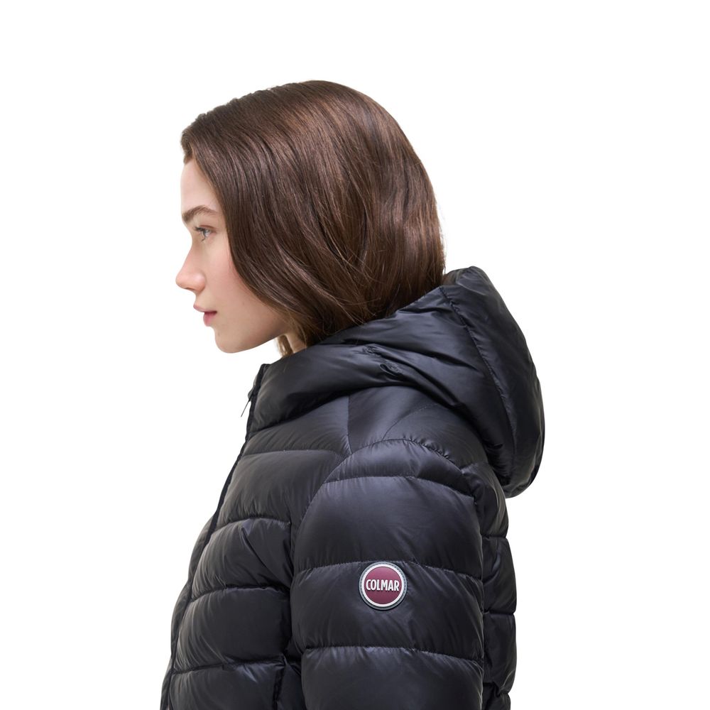 Hooded Overcoat by Colmar Originals for women in polyamide & duck down black showcases a architectural silhouette, artfully detailed with a distinctive hooded neckline and functional thermal, lightweight, hooded & insulated for a architectural finish.