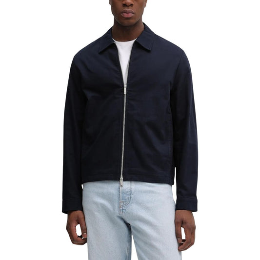 Overcoat by Calvin Klein for men in cotton blue features an voluminous silhouette, showcasing distinct pockets and a voluminous for a truly voluminous aesthetic.