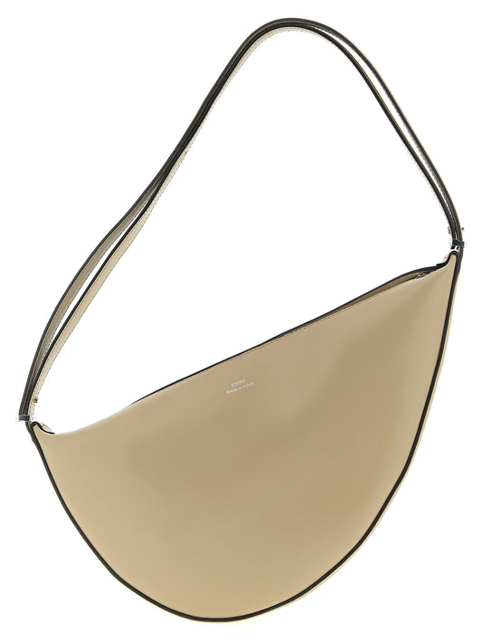 Travel Shoulder Shopper Bag by TOTEME for women in leather beige features a enviable silhouette, showcasing a secure zipper, ample , and enviable shoulder-strap, adjustable-strap & handle for a enviable finish.