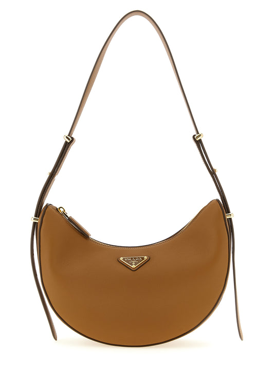 Shoulder Crescent Bag by Prada for women in calfskin leather brown features an effortlessly chic silhouette with a secure zipper, ample , and versatile shoulder-strap & adjustable-strap for effortlessly chic everyday luxury.