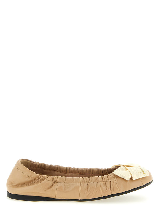 Ballet Flat Shoes by Prada for women in calfskin canvas cotton & rubber beige features an statuesque silhouette from the Women's Calfskin Canvas Cotton & Rubber Ballet Flat Shoes collection, showcasing a and a statuesque for a statuesque look.