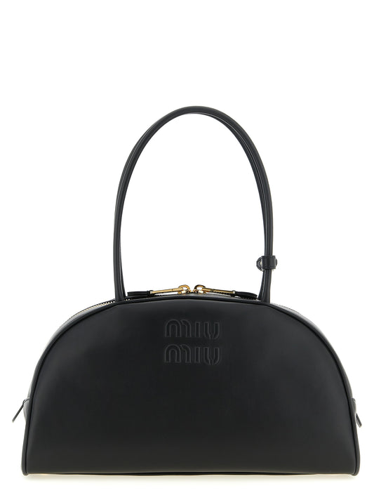 Shoulder Bowling Bag by Miu Miu for women in calfskin leather black & gold features a distinguished silhouette, showcasing a secure zipper and distinguished with versatile shoulder-strap & handle for a distinguished finish.