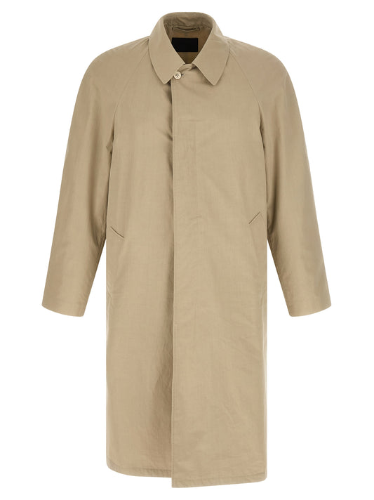 Trench Coat by Prada for men in cotton beige presents an sculptural silhouette, artfully detailed with a sculptural shirt-collar neckline and functional pockets for a truly sculptural finish.