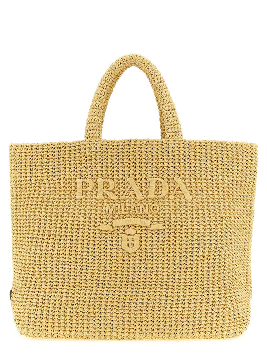 Shopper Tote Bag by Prada for women in metal & raffia beige features an utilitarian-chic silhouette, showcasing the Crochet Metal & Raffia Shopper Tote Bag design with a secure , ample , and versatile handle.