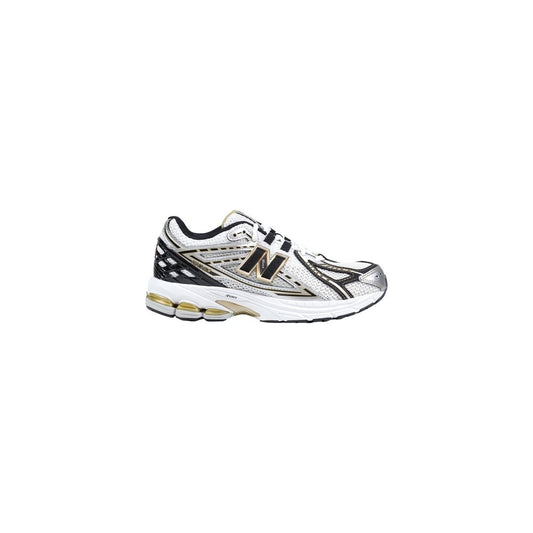 Athletic Sneakers by New Balance for women in synthetic textile & mesh silver features an timeless silhouette from the Women's Athletic Synthetic Textile & Mesh Sneakers collection, showcasing a timeless athletic style for a timeless look.
