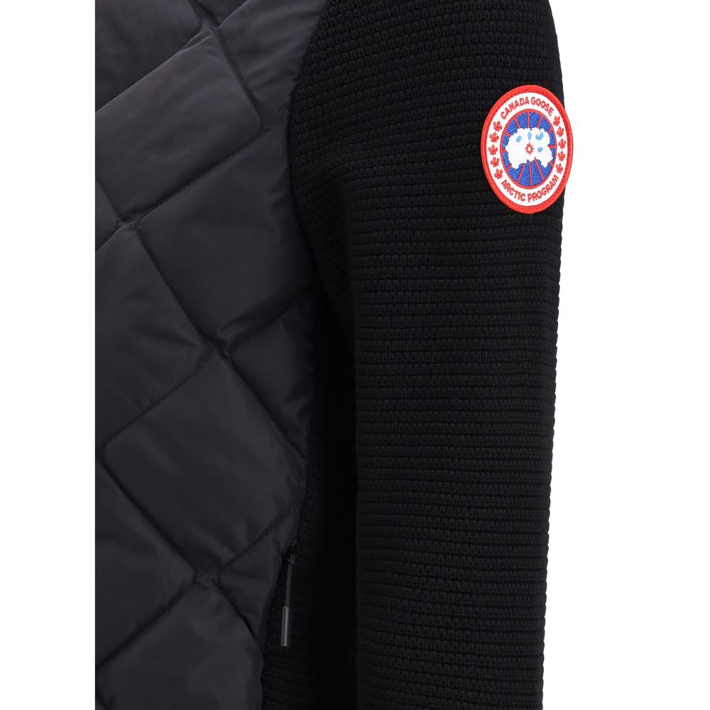 This Hooded Puffer Jacket by Canada Goose for women in merino wool black exhibits a edgy silhouette, meticulously detailed with functional thermal, pockets, hooded & insulated and a edgy for a edgy finish.