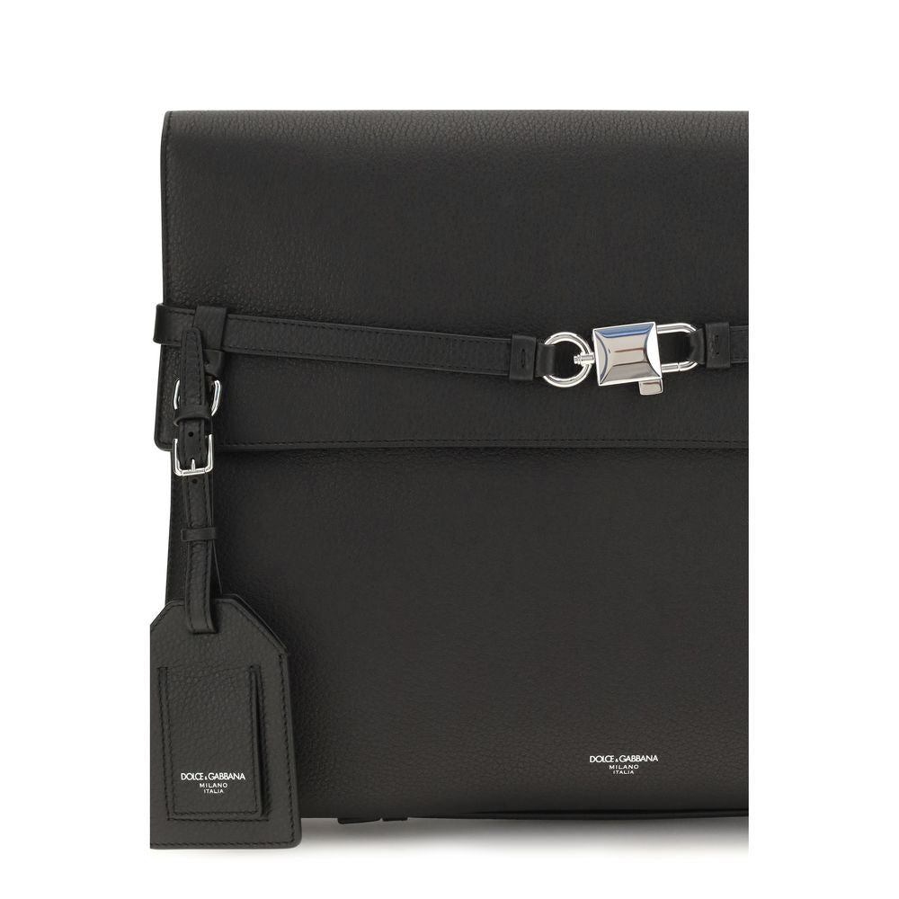 Compact Shoulder Bag by Dolce & Gabbana for men in bos taurus calf leather black & silver features a distinguished silhouette, showcasing a secure snap & button and distinguished cardholder with versatile shoulder-strap, adjustable-strap & detachable-strap for a distinguished finish.