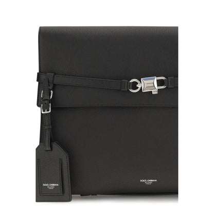 Compact Shoulder Bag by Dolce & Gabbana for men in bos taurus calf leather black & silver features a distinguished silhouette, showcasing a secure snap & button and distinguished cardholder with versatile shoulder-strap, adjustable-strap & detachable-strap for a distinguished finish.