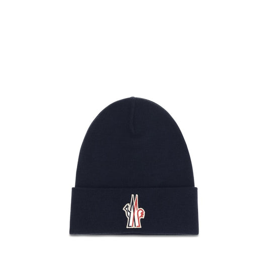 Beanie Hat by Moncler Grenoble for men in virgin wool blue & signature features a distinguished knit construction, showcasing the sophisticated silhouette and distinguished finish of the Virgin Wool Beanie Hat.