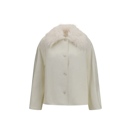 Overcoat by Loulou De Saison for women in cashmere merino wool & fur white presents a luxurious silhouette, showcasing a luxurious and sophisticated for a premium, luxurious look.