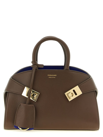 Handbag by Ferragamo for women in bos taurus calfskin leather bicolour, blue & brown presents a ornamental silhouette, showcasing a secure buckle, ample , and versatile detachable-strap for a ornamental finish.