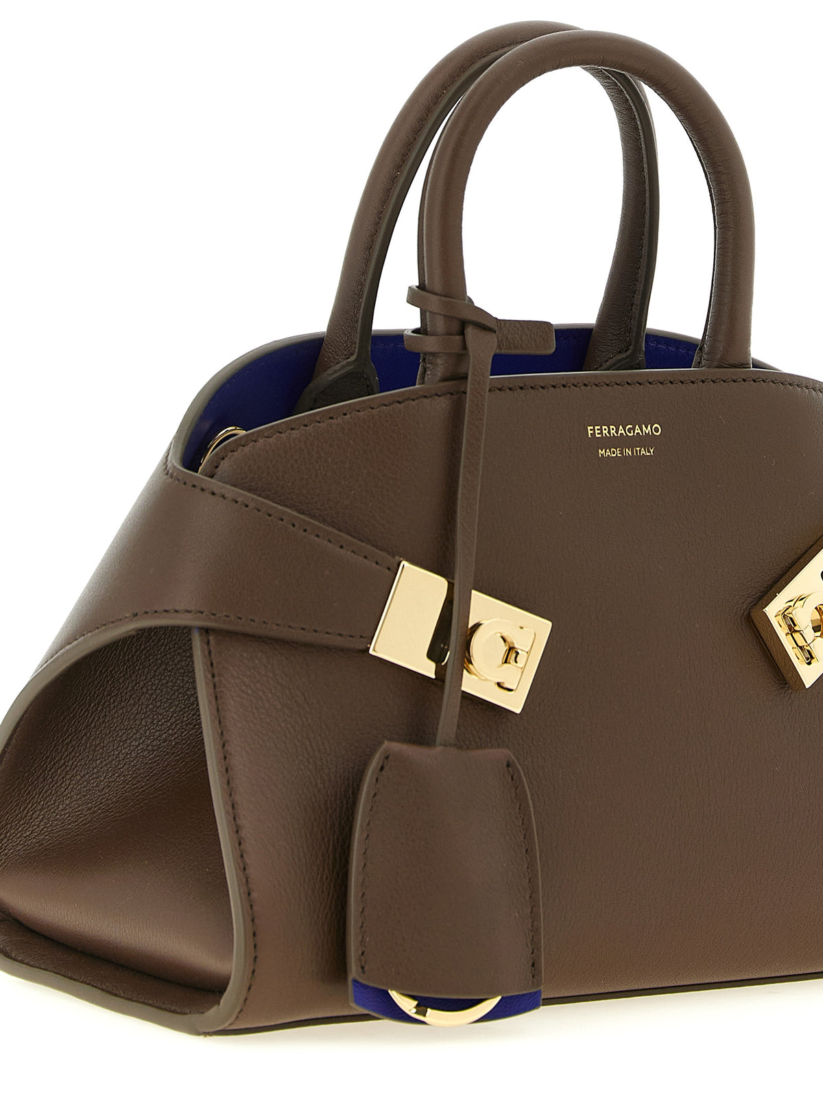Handbag by Ferragamo for women in bos taurus calfskin leather bicolour, blue & brown features a contemporary silhouette, showcasing a secure buckle, ample , and contemporary detachable-strap for a sophisticated look.