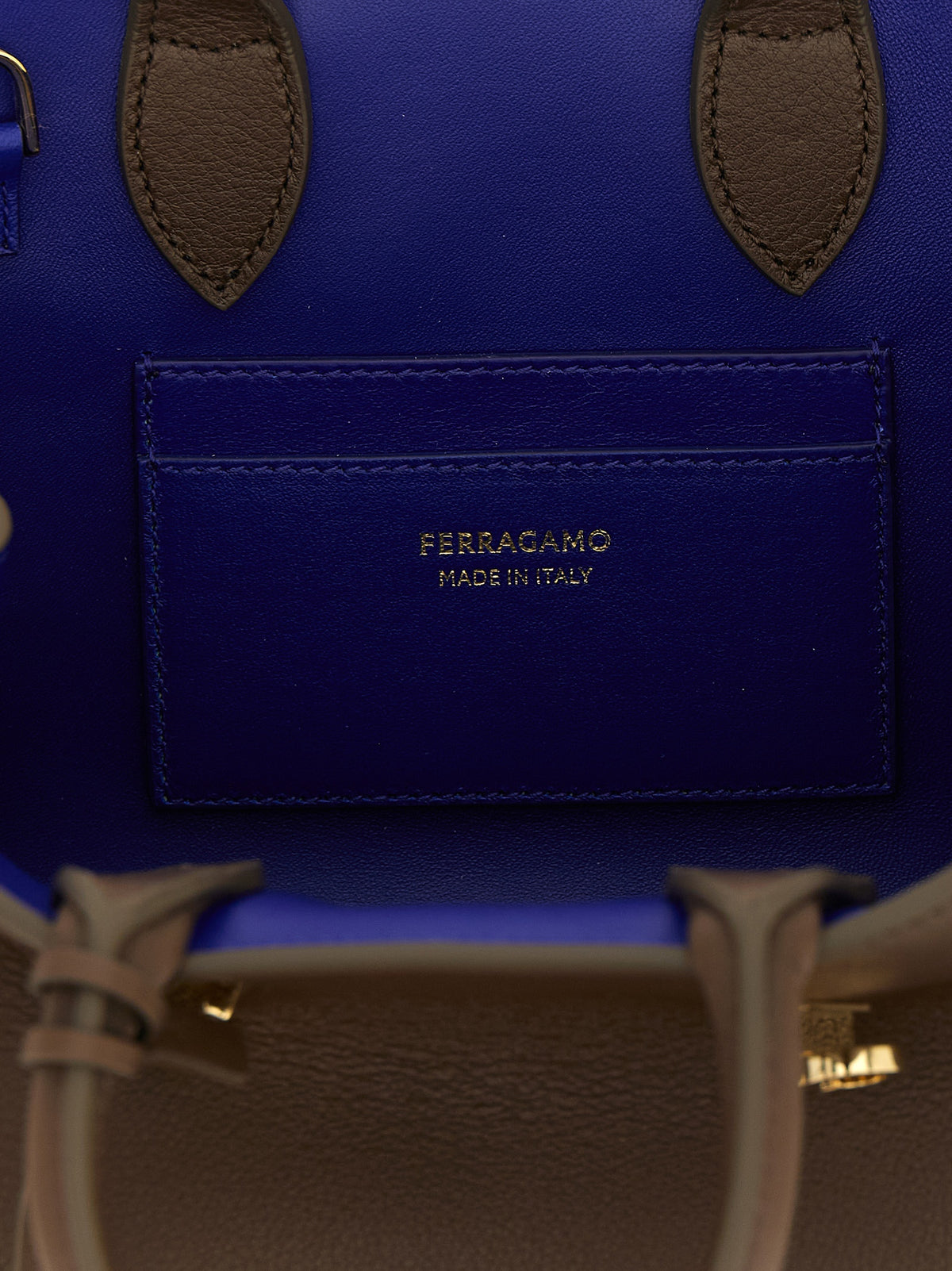 Handbag by Ferragamo for women in bos taurus calfskin leather bicolour, blue & brown presents a ornamental silhouette, showcasing a secure buckle, ample , and versatile detachable-strap for a ornamental finish.