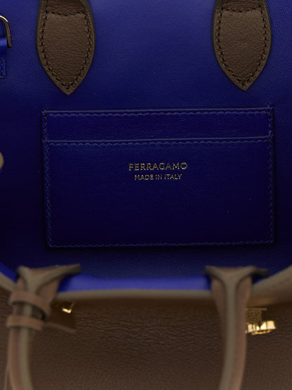 Handbag by Ferragamo for women in bos taurus calfskin leather bicolour, blue & brown presents a ornamental silhouette, showcasing a secure buckle, ample , and versatile detachable-strap for a ornamental finish.