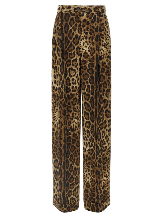 Trousers by Dolce & Gabbana for women in wool animal, brown & print presents a perennial silhouette, meticulously tailored with a cut, long finish, and an elegant high rise.