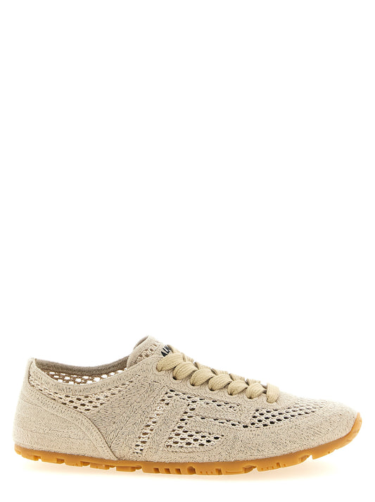 Athletic Sneakers by Balmain for women in polyester leather & cotton beige showcases a architectural silhouette, artfully capturing the essence of the Racer Women's Athletic Polyester Leather & Cotton Sneakers with its signature architectural athletic style construction.
