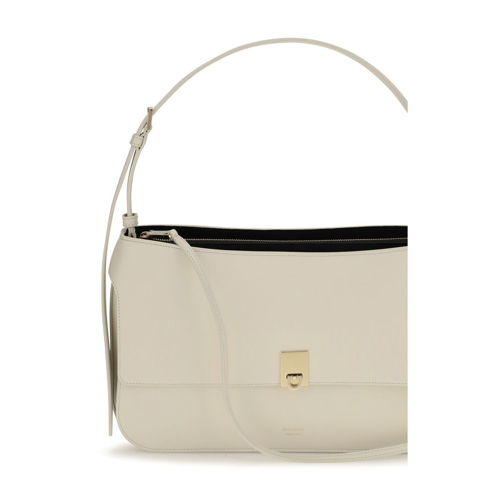 Small Shoulder Clutch Bag by Ferragamo for women in bos taurus calfskin leather beige & signature features a distinguished silhouette, showcasing a secure buckle and distinguished external-pockets with versatile shoulder-strap for a distinguished finish.