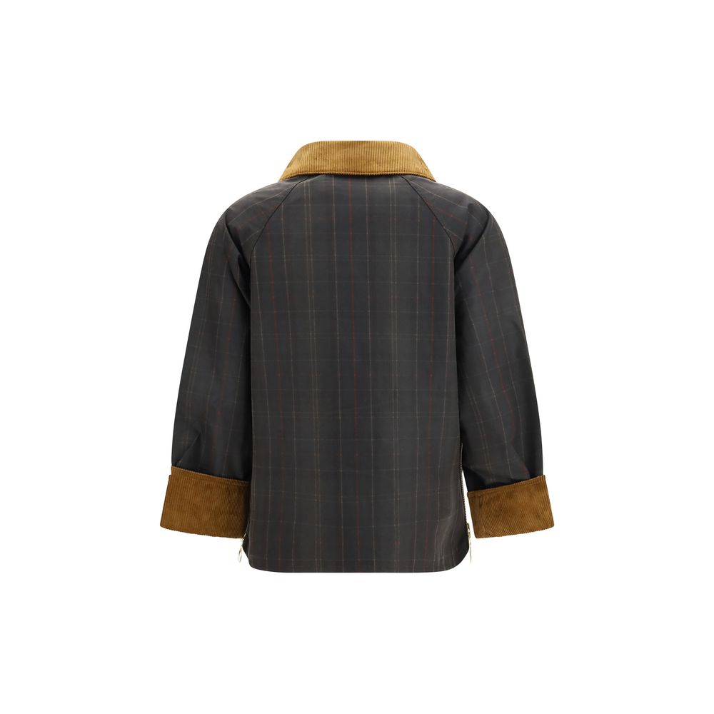 Overcoat by Barbour for women in cotton corduroy bicolour, horn, tartan & signature features an voluminous silhouette, showcasing distinct pockets and a voluminous for a truly voluminous aesthetic.