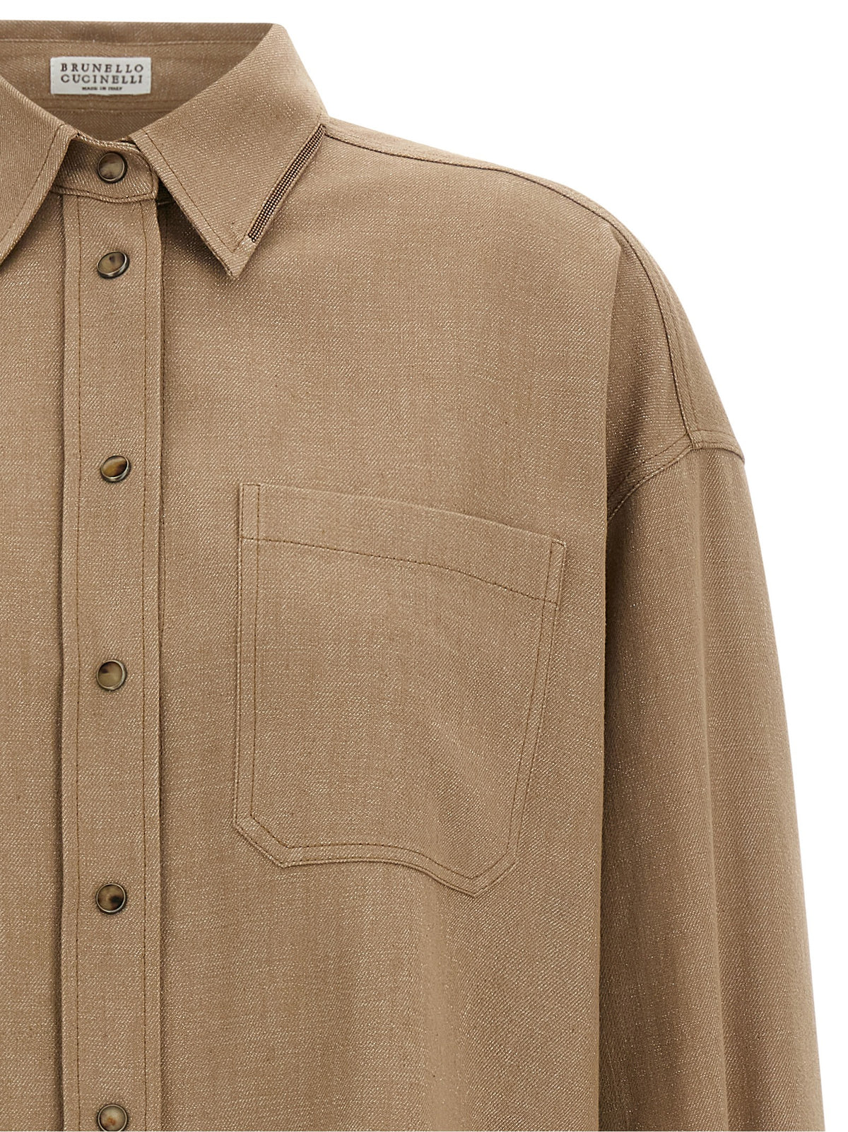 Blouse by Brunello Cucinelli for women in cotton denim polyamide & polyester beige, camel & horn showcases a sharp silhouette, elegantly detailed with a sharp and sharp .