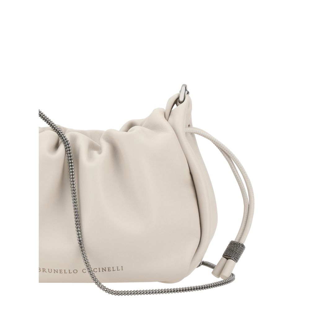 Mini Shoulder Bucket Bag by Brunello Cucinelli for women in bos taurus calf leather beige & monogram features a distinguished silhouette, showcasing a secure drawstring and distinguished single-compartment with versatile shoulder-strap for a distinguished finish.