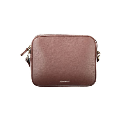 Handbag by Coccinelle for women in leather brown features a signature silhouette, showcasing a secure zipper and signature with versatile shoulder-strap & adjustable-strap for a sophisticated look.
