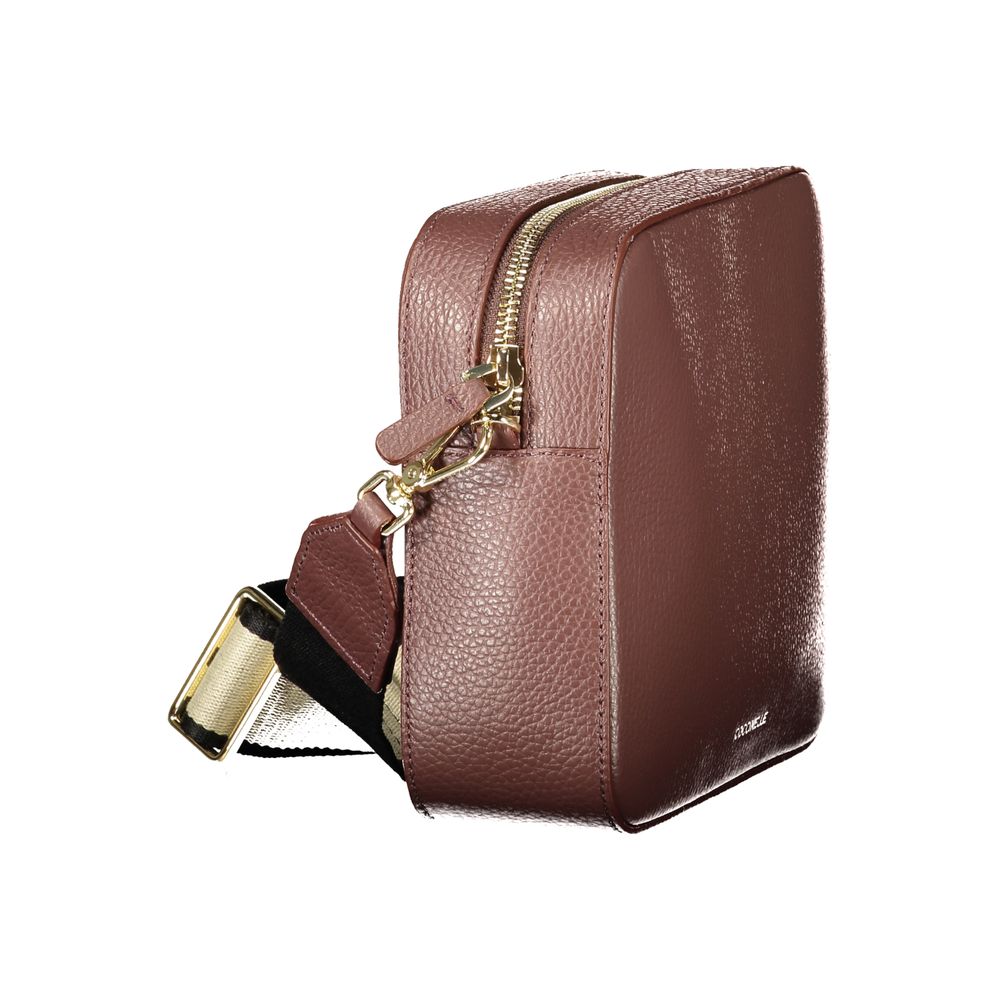 Handbag by Coccinelle for women in leather brown presents a ornamental silhouette, showcasing a secure zipper, ample , and versatile shoulder-strap & adjustable-strap for a ornamental finish.